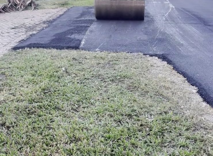 305UGC Dynapac roller compacting fresh asphalt on a South Miami residential road