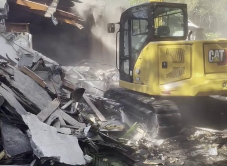 305UGC CAT excavator demolishing a residential structure in Cutler Bay Florida
